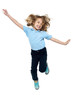 Photo: Energetic young child jumping high Energetic young child jumping high