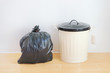 a black plastic bag and reuse disposal bin