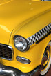 Photo: Yellow classic car taxi close up shot Yellow classic car taxi close up shot