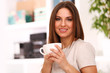 Young beautiful woman with cup