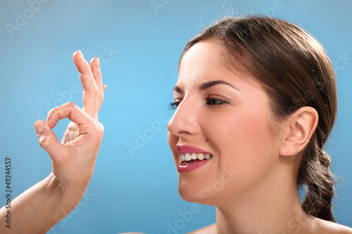 Photo: Caucasian natural woman with ok sign Caucasian natural woman with ok sign