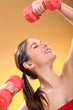 Caucasian woman with dumbbells