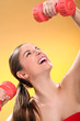 Caucasian woman with dumbbells