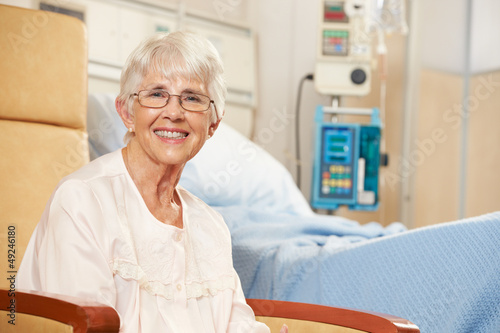 Photo: Portrait Of Senior Female Patient Seated By Hospital Bed Portrait Of Senior Female Patient Seated By Hospital Bed