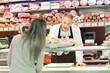 Shopkeeper serving a costumer