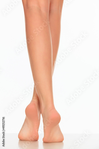Photo: pretty woman legs on white background pretty woman legs on white background