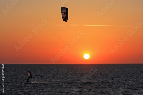 Photo: kitesurfer at sunset kitesurfer at sunset