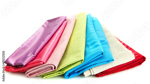 Photo: heap of cloth fabrics isolated on white heap of cloth fabrics isolated on white