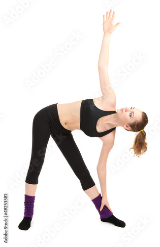Photo: Young women in yoga style isolated on white Young women in yoga style isolated on white