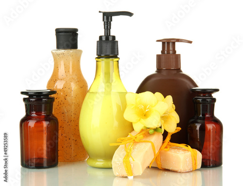 Photo: Liquid and hand-made soaps isolated on white Liquid and hand-made soaps isolated on white