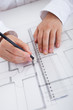 Architect working on blueprints