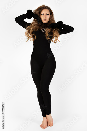 Photo: Woman in a black suit. Isolation on a white background . Woman in a black suit. Isolation on a white background .