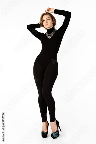 Photo: Woman in a black suit. Isolation on a white background . Woman in a black suit. Isolation on a white background .