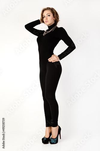 Photo: Woman in a black suit. Isolation on a white background . Woman in a black suit. Isolation on a white background .