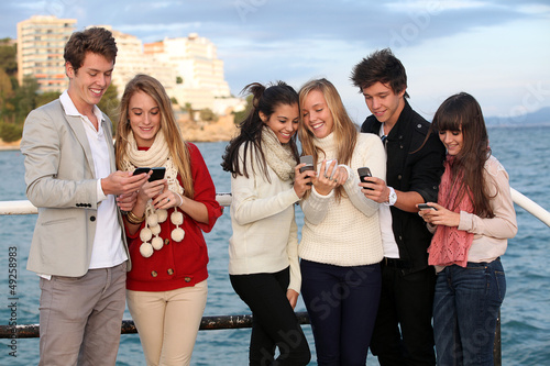 Photo: kids with mobile or cell phones kids with mobile or cell phones
