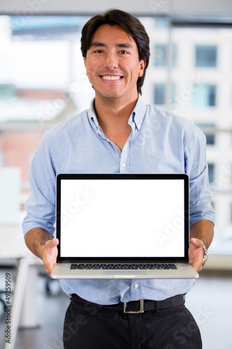 Photo: Business man with a laptop Business man with a laptop
