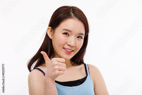 Photo: Young Asian show thumb close up shot Young Asian show thumb close up shot