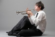 Portrait of a young man playing his Trumpet