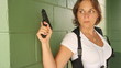 Female Detective With Gun Searching For A Suspect