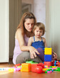 pregnant mother plays with child