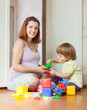 pregnant mother plays with child