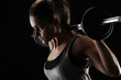 Photo: Young woman lifting weights Young woman lifting weights