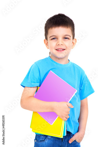Photo: little boy with notebooks little boy with notebooks