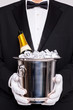 Waiter with Champagne in a silver cooler