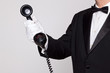 Butler holding a phone handset