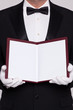 Photo: Waiter holding open a blank menu Waiter holding open a blank menu