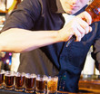 barman making  drink shots
