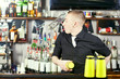 Professional barmen making cocktail