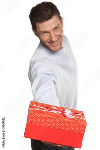 Photo: Handsome Man Offering A Present On White Background Handsome Man Offering A Present On White Background