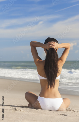 Photo: Sexy Woman Girl Sitting in Bikini on Beach Sexy Woman Girl Sitting in Bikini on Beach
