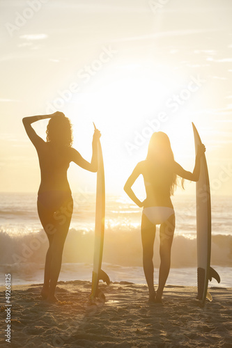 Photo: Beautiful Bikini Women Surfers & Surfboards At Beach Beautiful Bikini Women Surfers & Surfboards At Beach