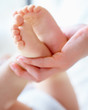 Cradling tiny feet!