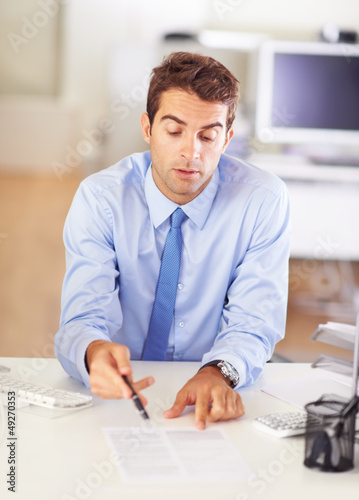 Photo: Reviewing a prospective employee's resume Reviewing a prospective employee's resume