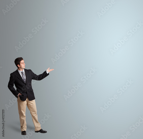 Photo: handsome man presenting copy space handsome man presenting copy space