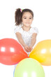 Little brunette girl with balloons in studio