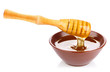 honey in pottery pan with dipper