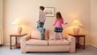 Video: Two kids jump on sofa at room with lamps on each side Two kids jump on sofa at room with lamps on each side