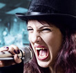 girl with microphone in  black top-hat