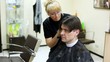 Video: Hairdresser cuts hair to man with long hair Hairdresser cuts hair to man with long hair