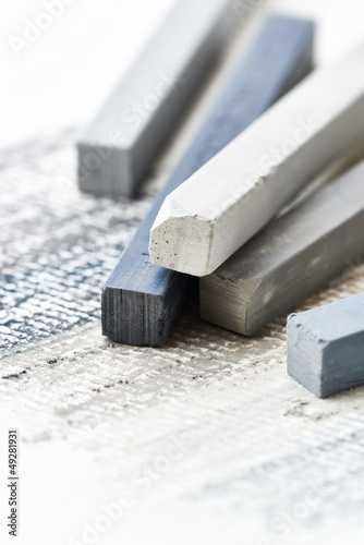 Photo: Close up of gray hard pastels Close up of gray hard pastels