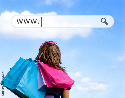 Photo: Girl holding shopping bags with address bar above Girl holding shopping bags with address bar above