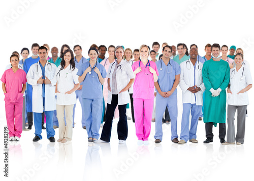 Photo: Happy team of smiling doctors standing together Happy team of smiling doctors standing together