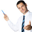 Foto: Business man showing area for sign or copyspace Business man showing area for sign or copyspace
