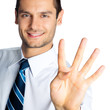 Businessman showing four fingers, isolated