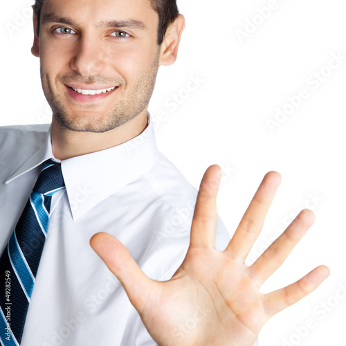 Photo: Businessman showing five fingers, isolated Businessman showing five fingers, isolated