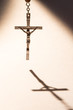 Cross casting a shadow